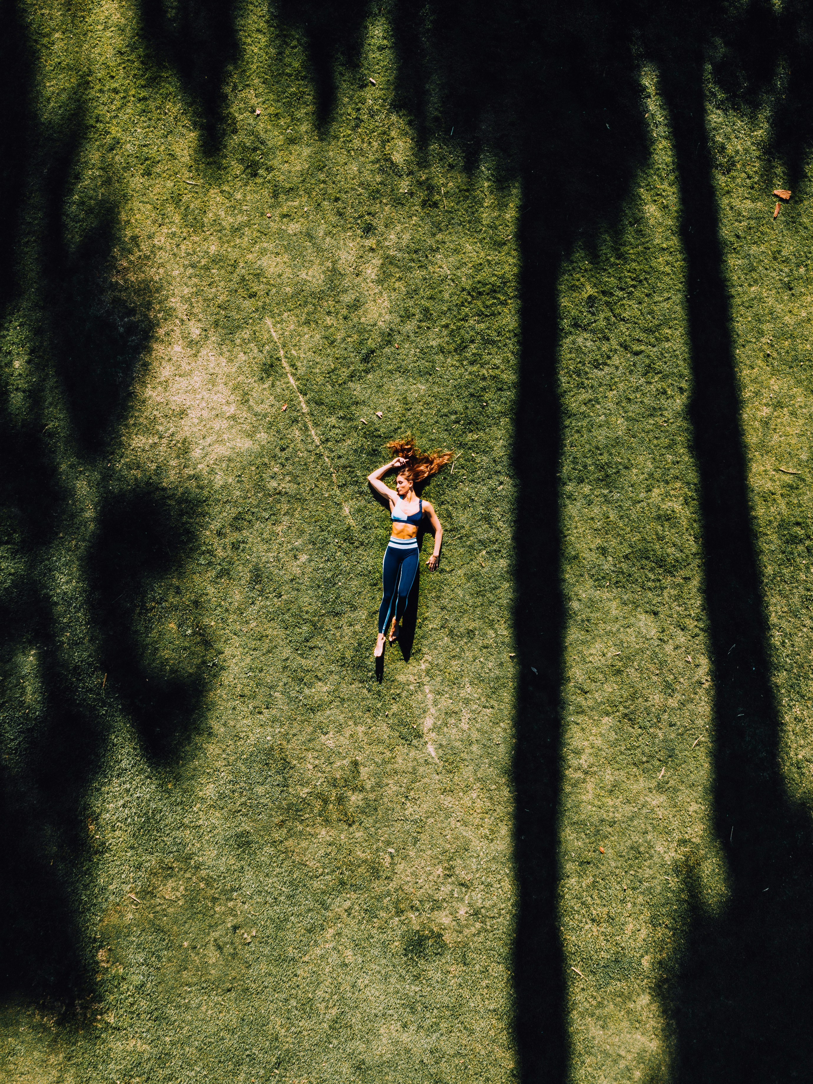 A person resting in a sunlit field